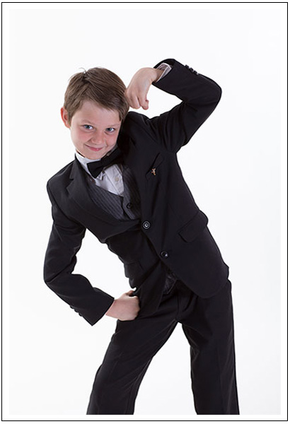 portrait of a boy wearing a tuxedo